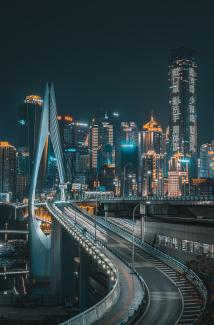 city skyline during night time by Jerry Wang courtesy of Unsplash.