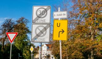 zone and u-turn road signs by Sangga Rima Roman Selia courtesy of Unsplash.
