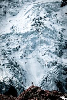 person standing on rock front of snow-capped mountain in nature photography by Will Turner courtesy of Unsplash.