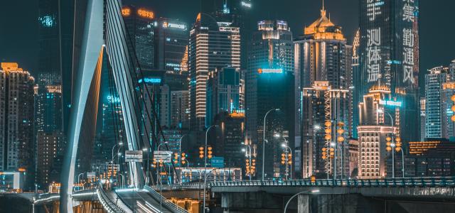 city skyline during night time by Jerry Wang courtesy of Unsplash.
